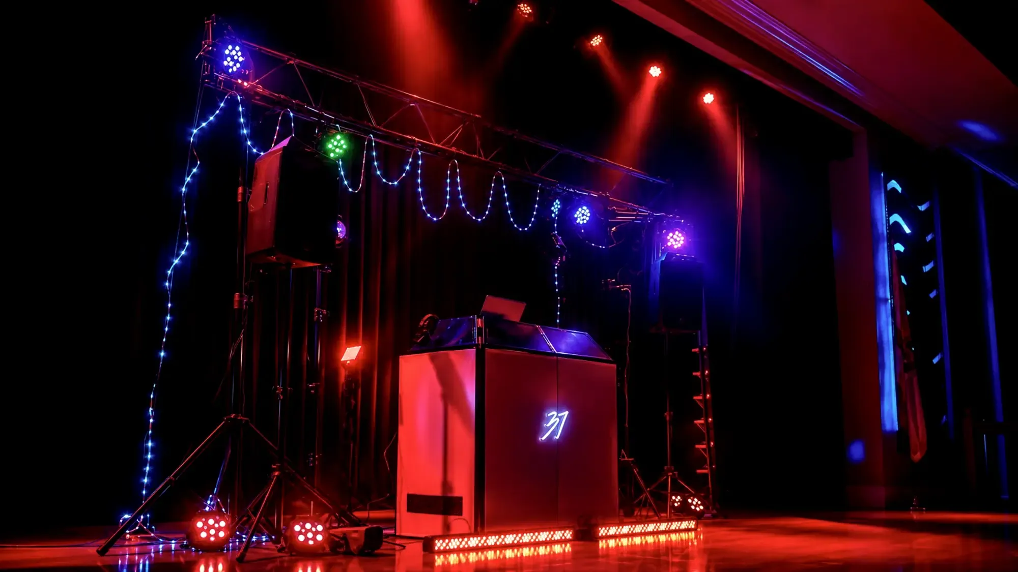 Lighting and PA rigged over a venue floor