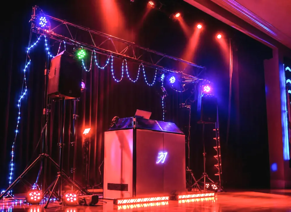 DJ Studio 37 booth, truss and stage lighting set up for an event